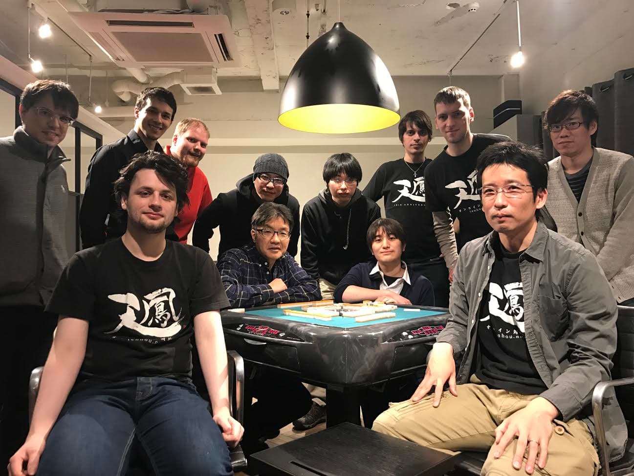 Nicolas with friends around a mahjong table